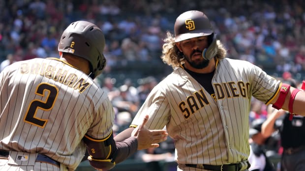 Apr 10, 2022; Phoenix, Arizona, USA; San Diego Padres catcher Jorge Alfaro celebrates with San Diego Padres center fielder Trent Grisham (2) after hitting a solo home run against the Arizona Diamondbacks during the second inning at Chase Field. Mandatory Credit: Joe Camporeale-USA TODAY Sports  